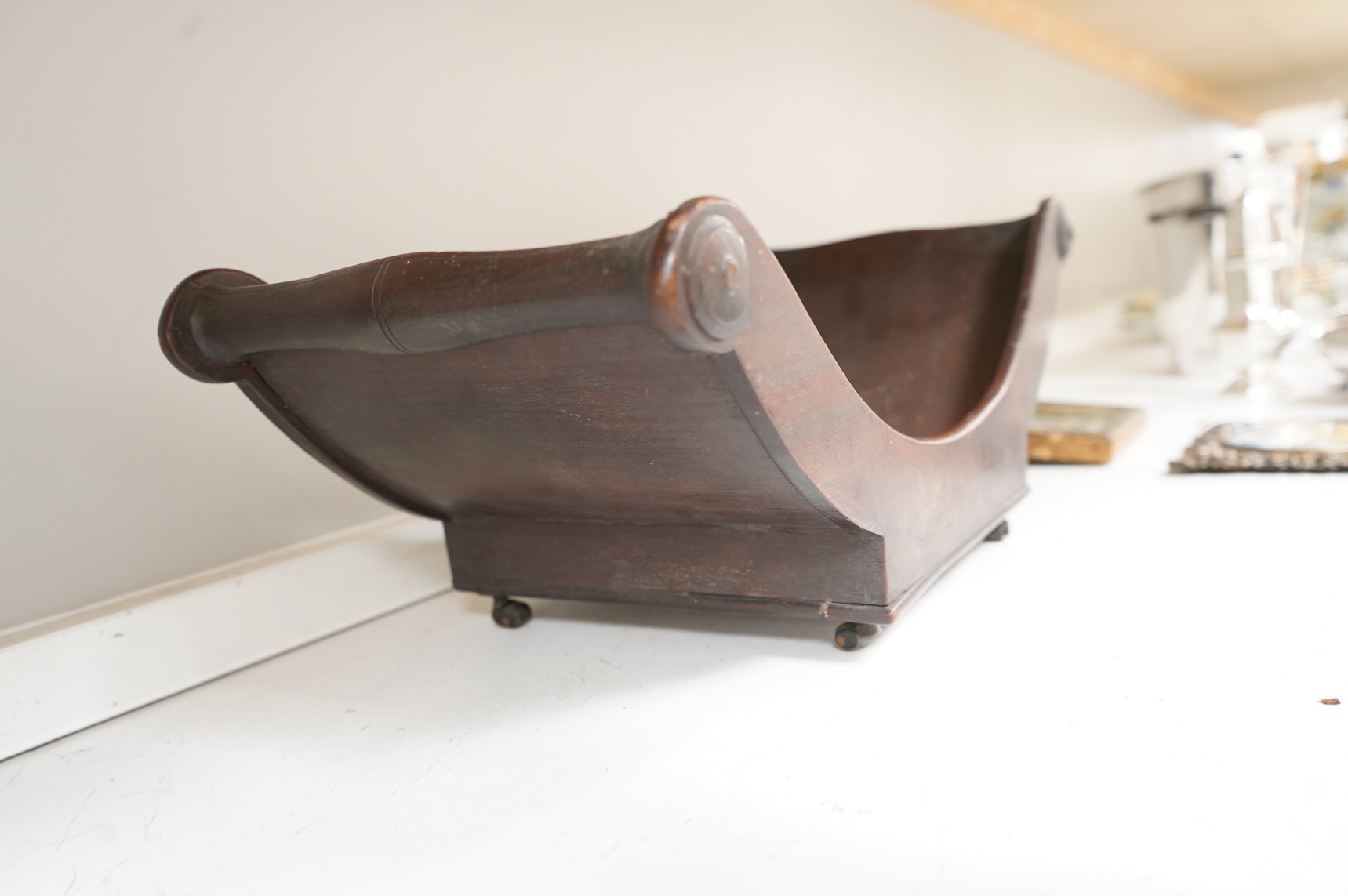 A George III mahogany cheese coaster, with original brass castors, 43cm wide